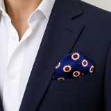 Navy Blue and Gold Reversible pocket square — navy jacket · wearing detail.