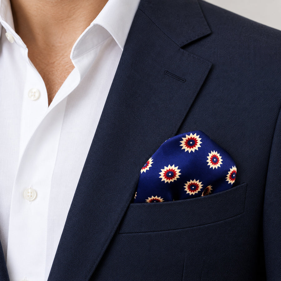 Navy Blue and Gold Reversible pocket square — navy jacket · wearing detail.