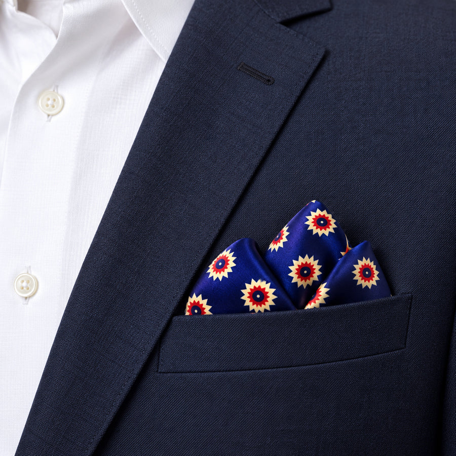 Navy Blue and Gold Reversible pocket square — navy jacket · alternate fold.