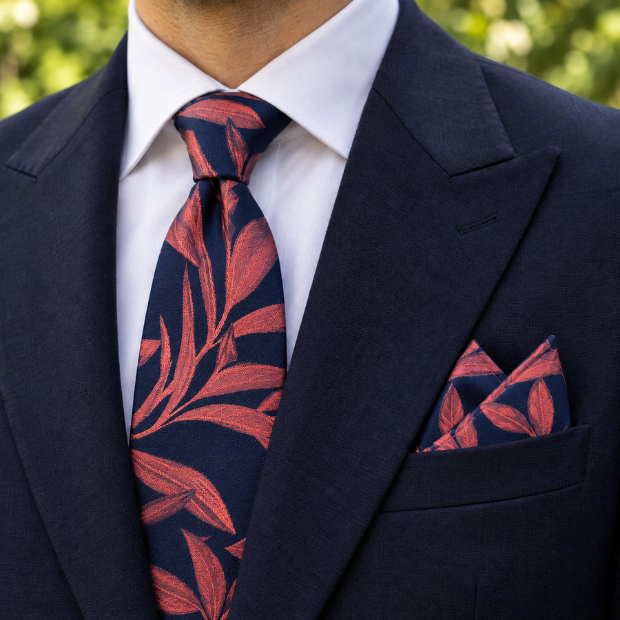Navy Coral Laurel Leaf silk tie and matching pocket square — Navy peak lapel · pointed fold