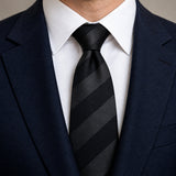 Noir Shadow Stripe Silk Tie — Knot and lapel close-up