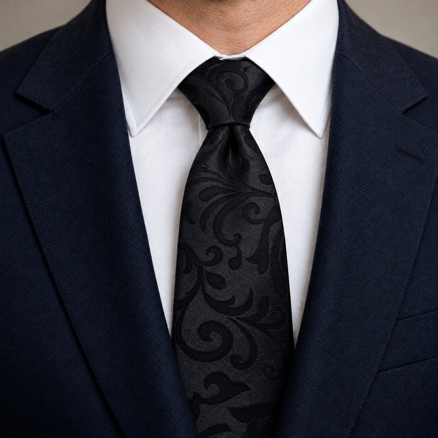 Onyx Damask Scroll Silk Tie — Knot and lapel close-up