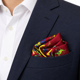Maroon Paisley and Floral pocket square — navy jacket · alternate fold.
