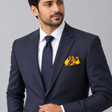 Paisley and Floral Mustard pocket square — formal model · navy and tie.