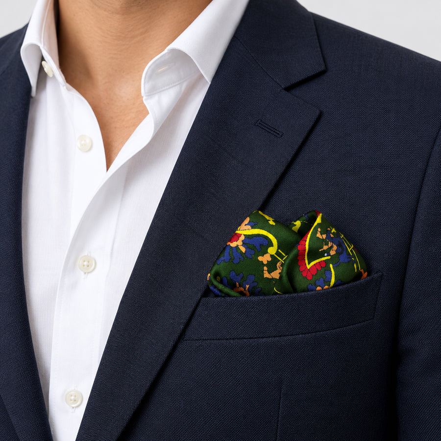 Olive Green Paisley and Floral pocket square — navy jacket · wearing detail.