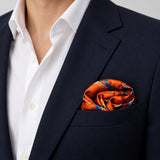 Rust Paisley and Floral pocket square — navy jacket · wearing detail.
