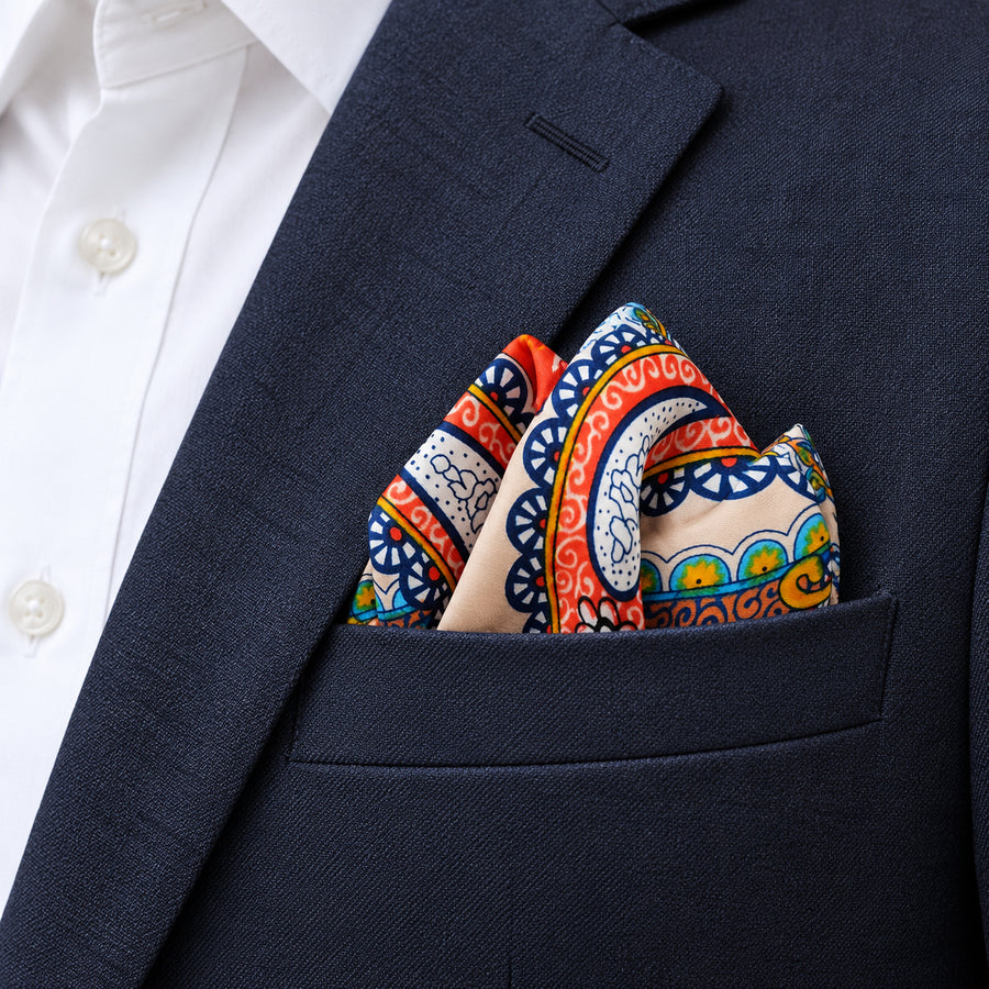 Paisley Art Show pocket square — navy jacket · alternate fold.