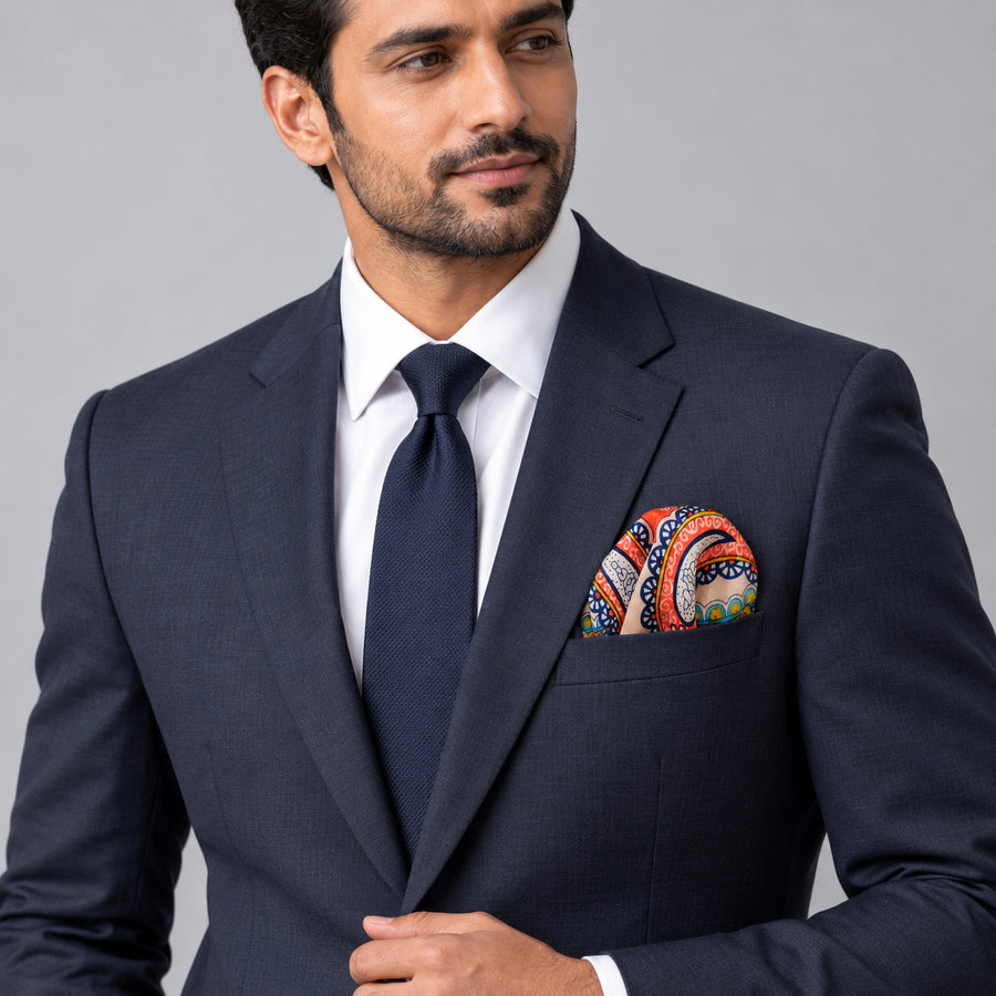 Paisley Art Show pocket square — formal model · navy and tie.