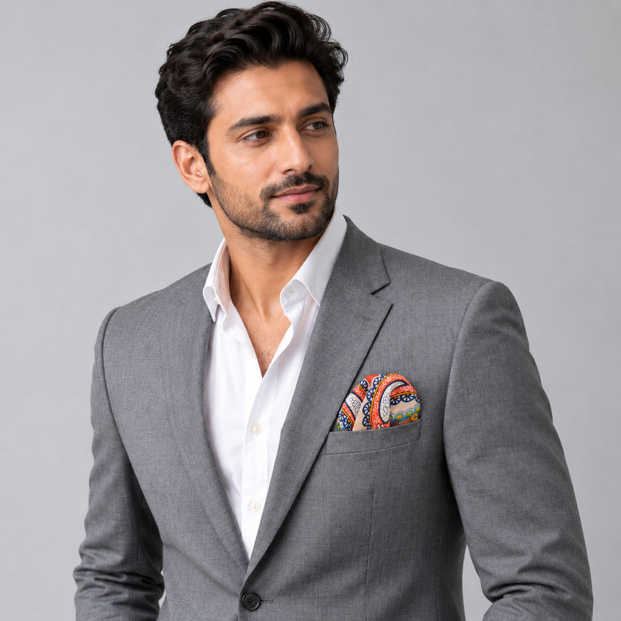 Paisley Art Show pocket square — model · light grey and open collar.