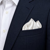 Pearl White Paradigm pocket square — navy jacket · alternate fold.