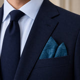 Petrol Blue Botanical Jacquard Silk Pocket Square — Navy jacket · pointed fold