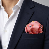 Pink Paisley Petals pocket square — navy jacket · wearing detail.