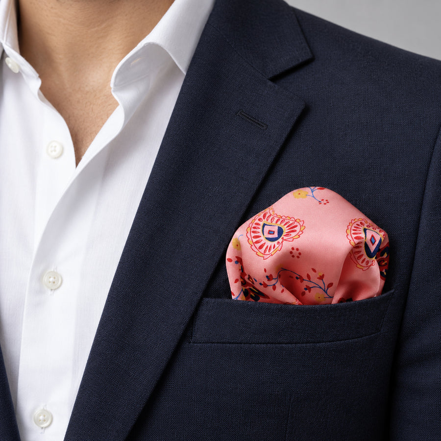 Pink Paisley Petals pocket square — navy jacket · wearing detail.