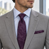 Plum Tropical Bloom silk tie and matching pocket square — Stone grey · pale blue shirt