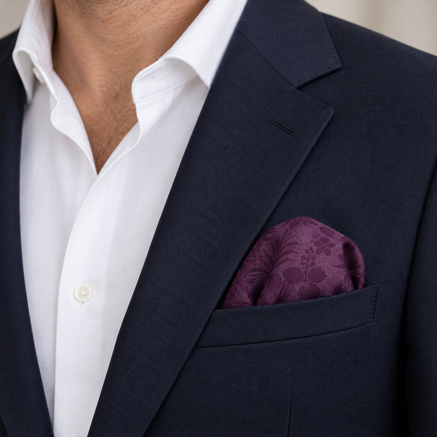 Plum Tropical Bloom Silk Pocket Square — navy jacket · rounded puff.