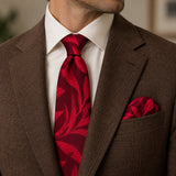 Scarlet Laurel Leaf silk tie and matching pocket square — Tobacco brown · notch lapel