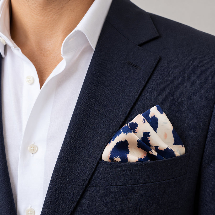 Snow Leopard pocket square — navy jacket · wearing detail.