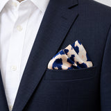 Snow Leopard pocket square — navy jacket · alternate fold.