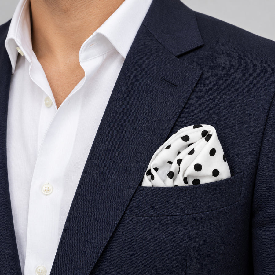 Snow White Base Polka pocket square — navy jacket · wearing detail.
