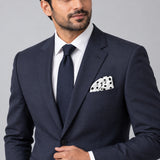 Snow White Base Polka pocket square — formal model · navy and tie.