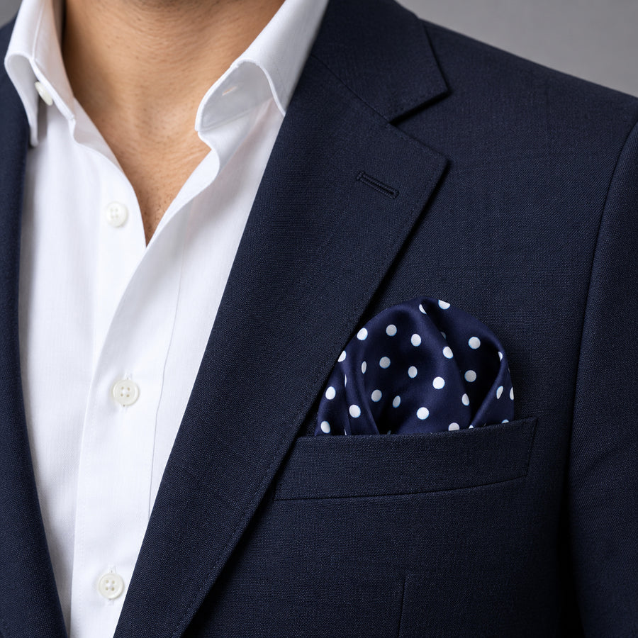 Starry Blue Night Polka Dots pocket square — navy jacket · wearing detail.