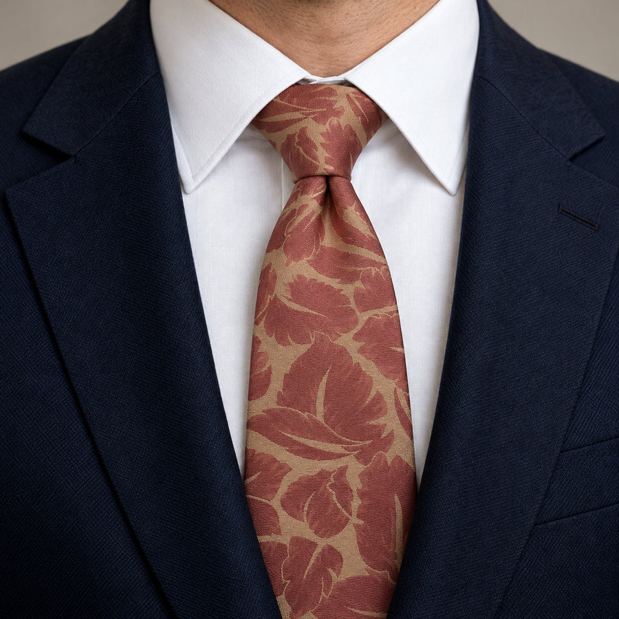 Terracotta Leaf Silhouette Silk Tie — Knot and lapel close-up
