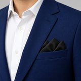 The Black Matter pocket square — navy jacket · alternate fold.