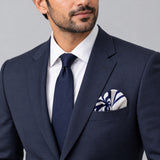 The Blue Chronicles pocket square — formal model · navy and tie.