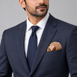 The Colour Trip pocket square — formal model · navy and tie.