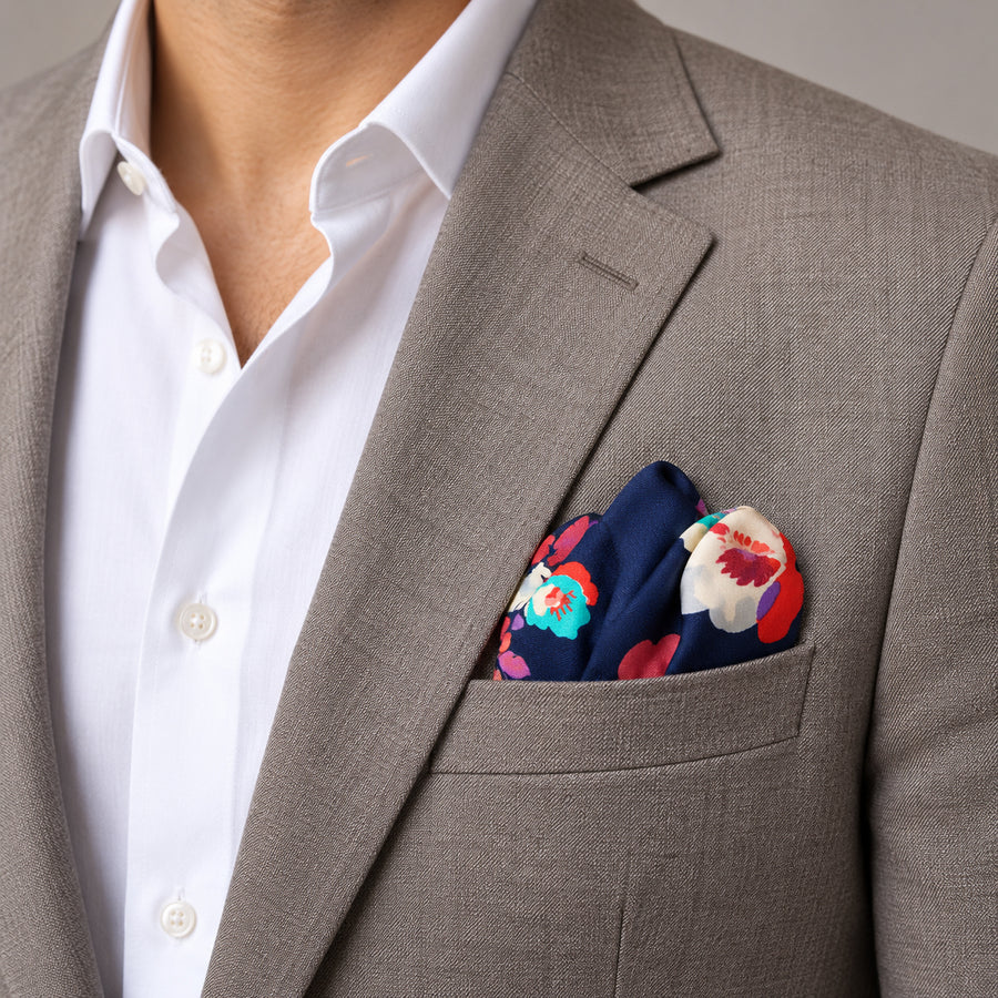 The Deep Blue Floral pocket square — light jacket · wearing detail.