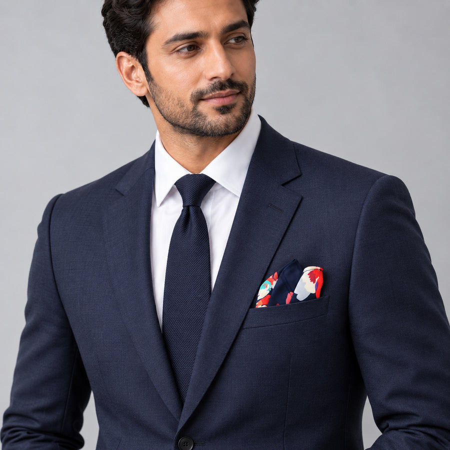 The Deep Blue Floral pocket square — formal model · navy and tie.