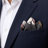 The Grey Garden pocket square — navy jacket · alternate fold.