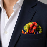 The Mighty Blue Jungle pocket square — navy jacket · wearing detail.