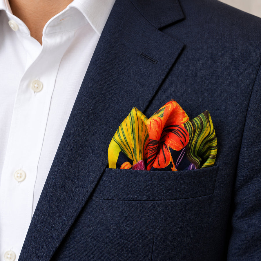 The Mighty Blue Jungle pocket square — navy jacket · alternate fold.