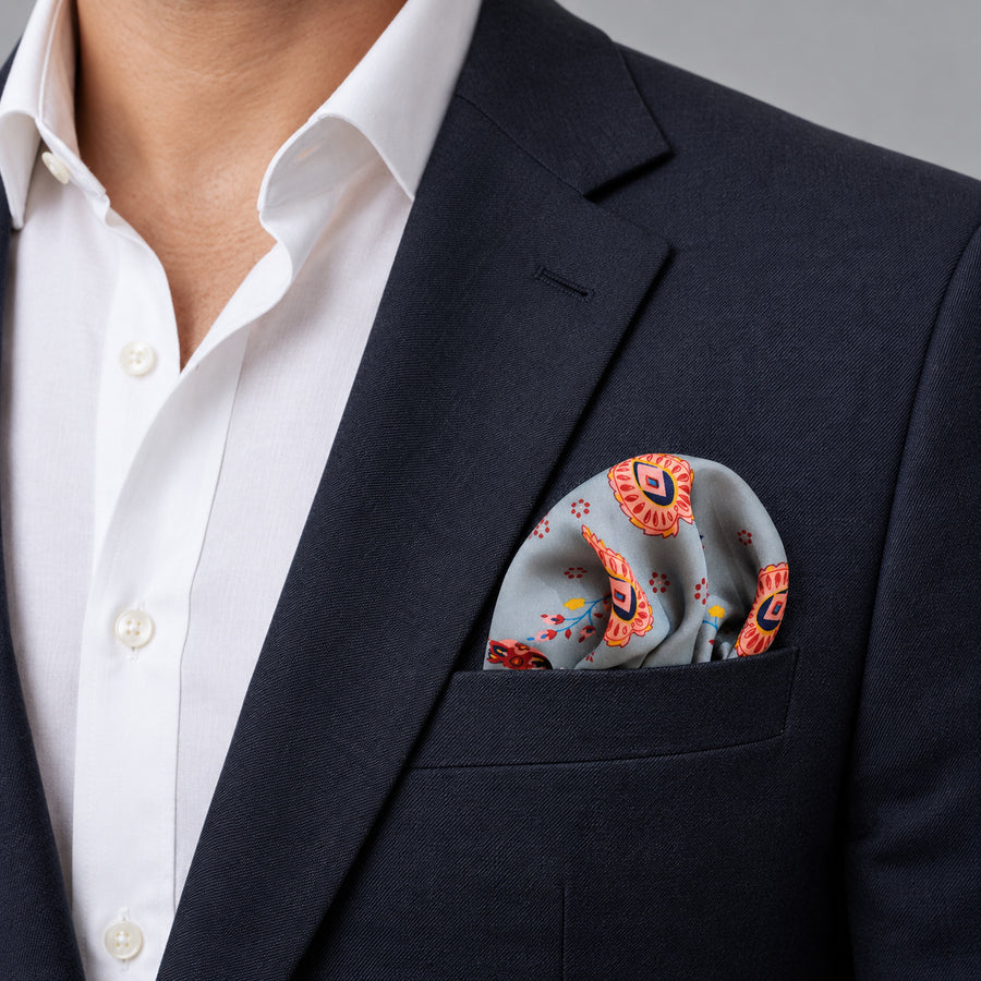 The Paisley Petals pocket square — navy jacket · wearing detail.