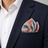 The Paisley Petals pocket square — navy jacket · alternate fold.