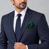 Deep Green pocket square — formal model · navy and tie.