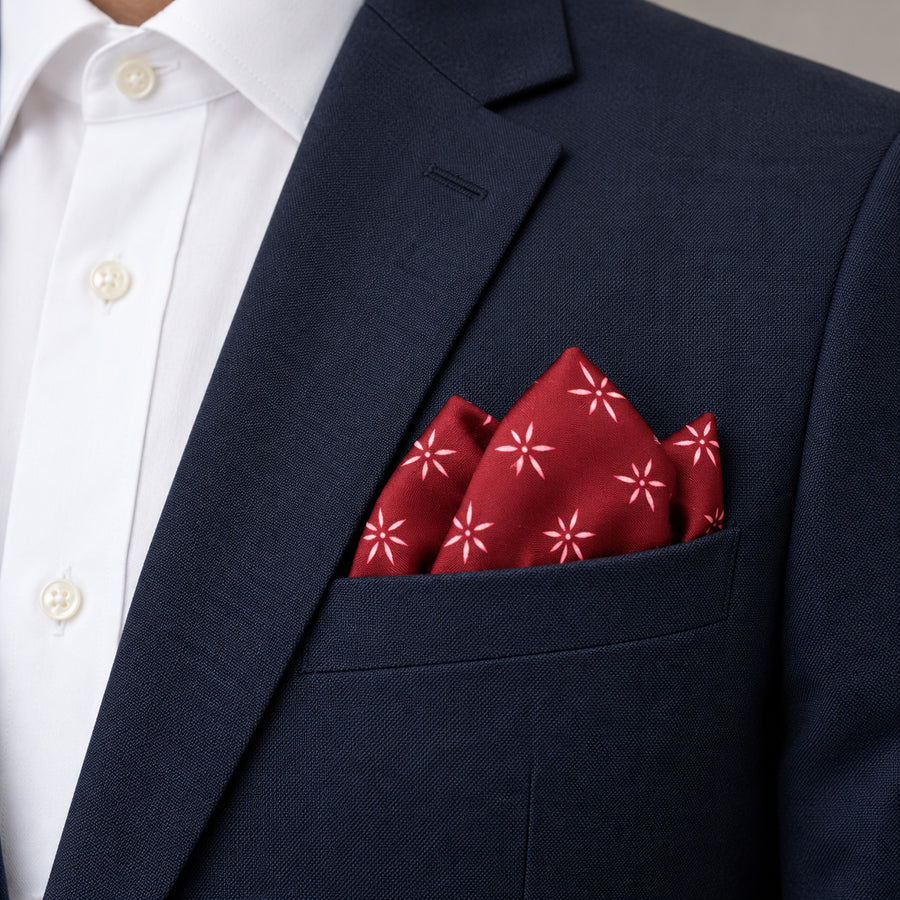 Twinkle Maroon pocket square — navy jacket · alternate fold.