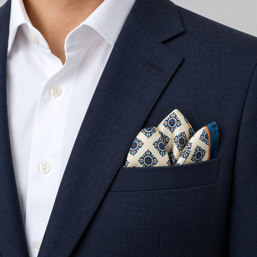 Ukrainian Folk Art pocket square — navy jacket · alternate fold.