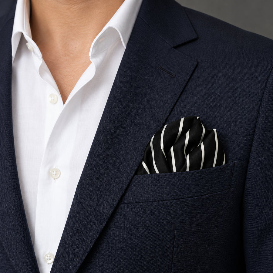 White Cane Crow pocket square — navy jacket · wearing detail.