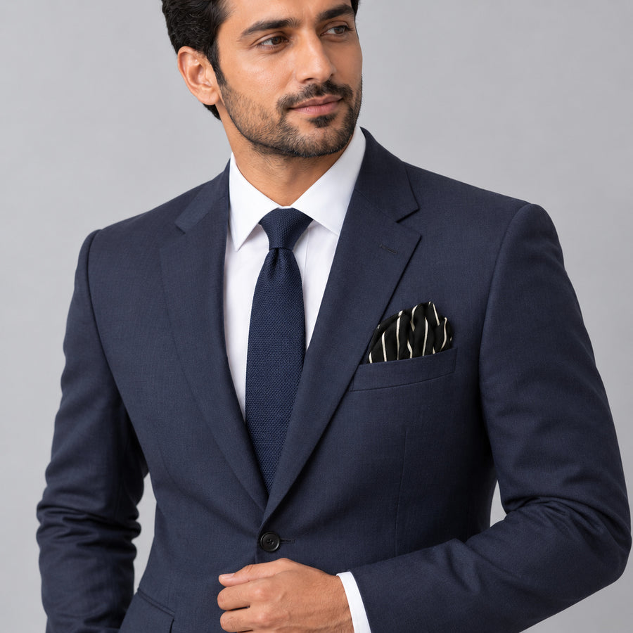 White Cane Crow pocket square — formal model · navy and tie.