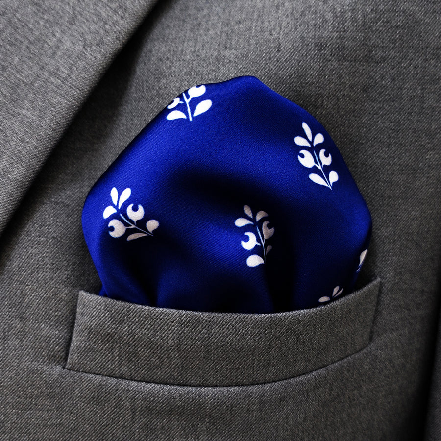 White Conifer pocket square — close-up wearing detail.