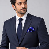 White Conifer pocket square — formal model · navy and tie.