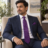 Amethyst Scroll Damask silk tie and matching pocket square — Navy suit · seated lifestyle