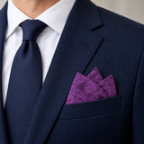 Amethyst Scroll Damask Silk Pocket Square — navy jacket · pointed fold.