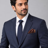 Chocolate HoneyComb pocket square — formal model · navy and tie.