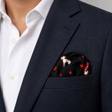 Black Dalmatian pocket square — navy jacket · wearing detail.