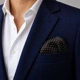 Black Dot Polka pocket square — navy jacket · wearing detail.