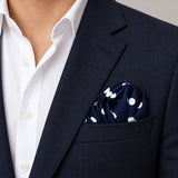 Blue Polka Drops pocket square — navy jacket · wearing detail.