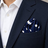 Blue Polka Drops pocket square — navy jacket · alternate fold.